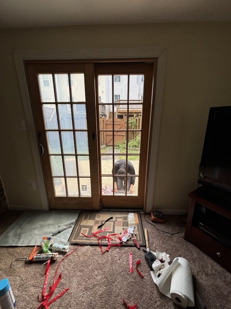 French patio door glass replacement in progress in a living room
