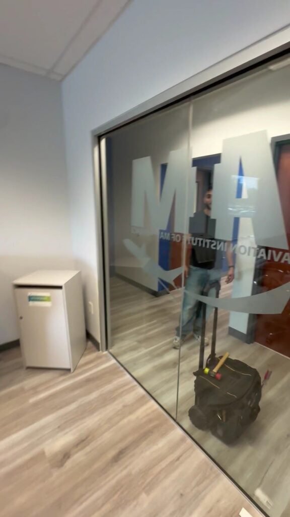 Frosted logo glass wall installed in an office