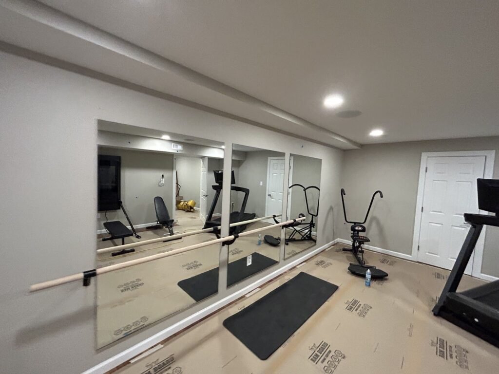 Wall mirrors installed in a home gym